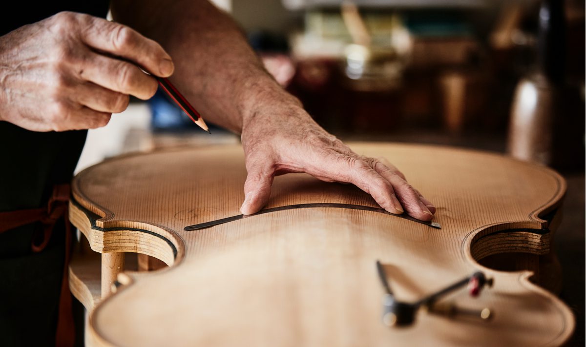 Drawing f-hole placement on a new cello belly
